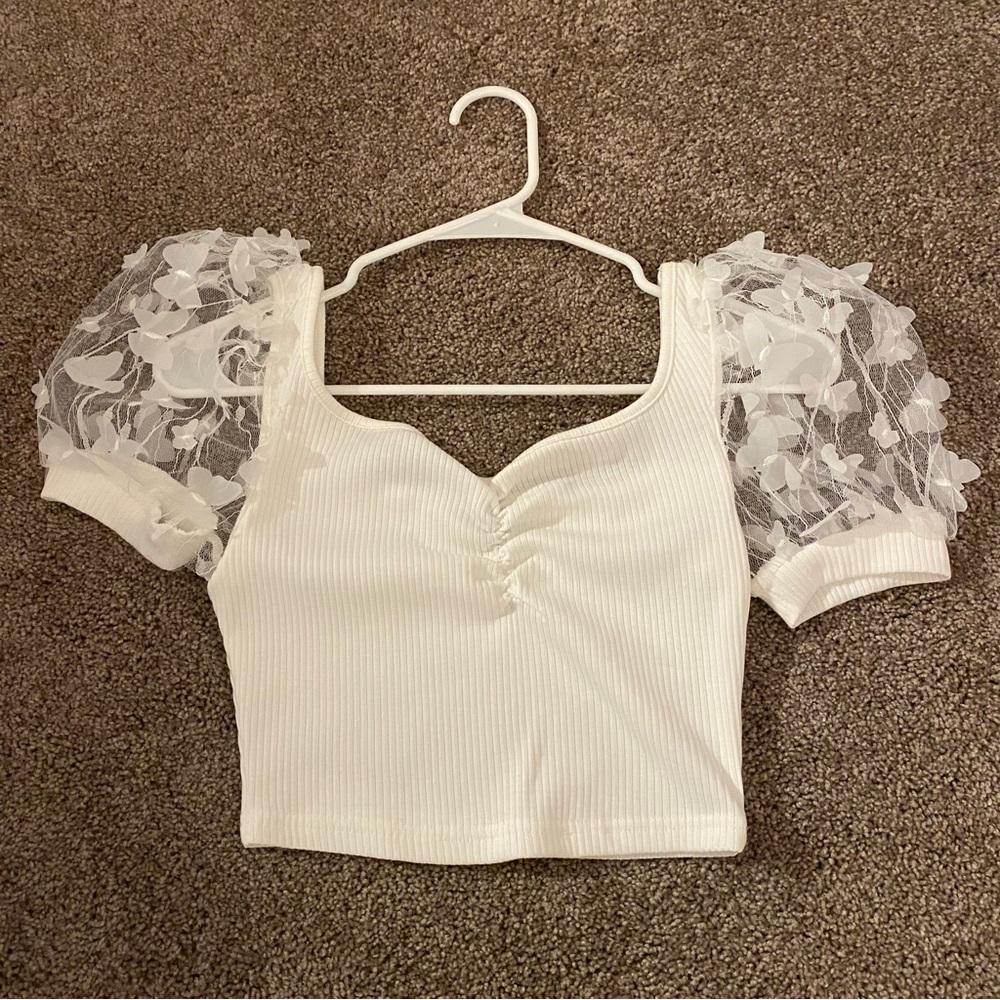 white top with butterfly sleeves